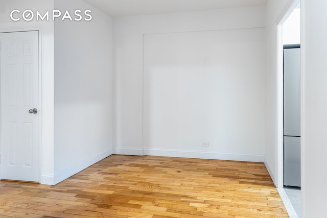 99-21 67th Rd Unit 7A, New York City, NY 11375 - unfurnished room featuring light wood finished floors and baseboards