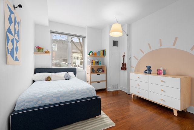 bedroom featuring dark wood-type flooring