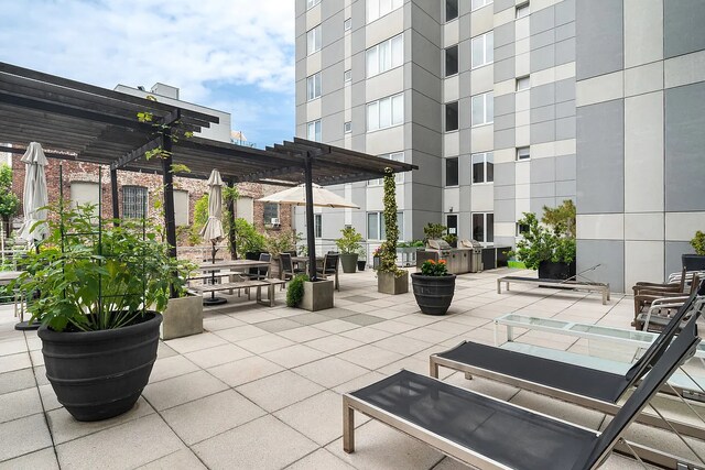 view of patio featuring a pergola