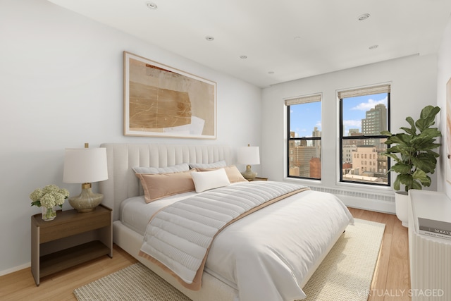 bedroom featuring light hardwood / wood-style floors