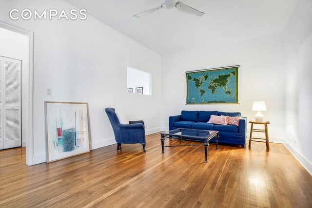 sitting room featuring hardwood / wood-style flooring and ceiling fan