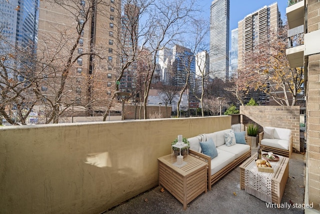 view of patio with a view of city and outdoor lounge area