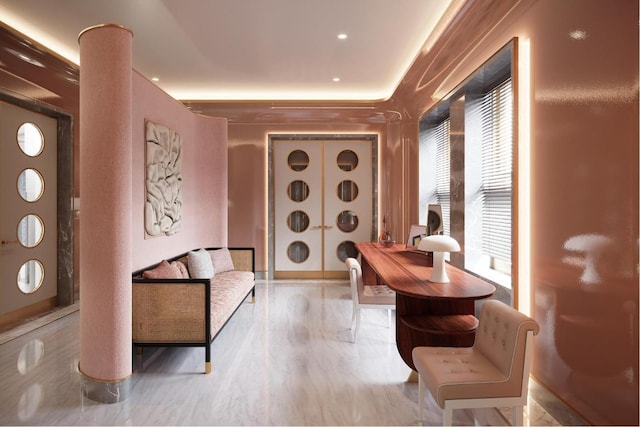 sitting room with light hardwood / wood-style floors and decorative columns