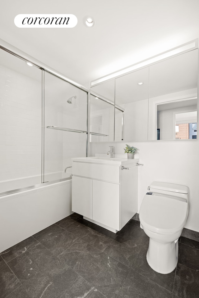 full bath with recessed lighting, vanity, combined bath / shower with glass door, and toilet