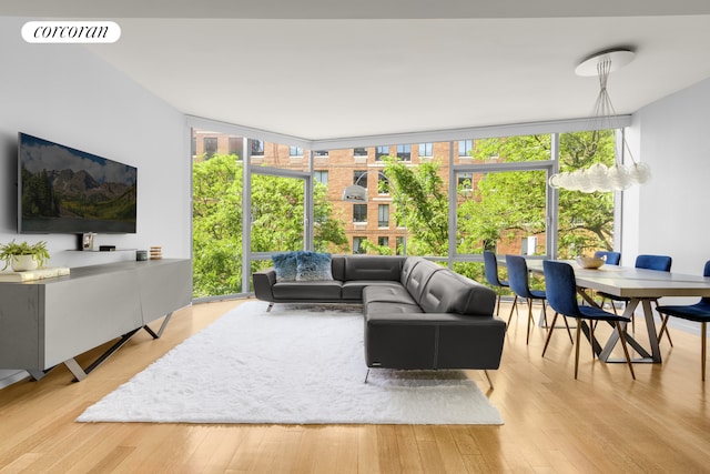 425 W 53rd St Unit 409, New York City, NY 10019 - living room with floor to ceiling windows and wood finished floors