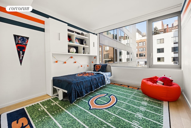 bedroom with wood-type flooring