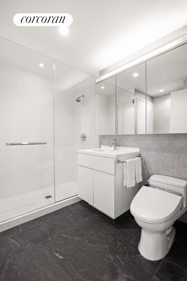 full bath with tile walls, a shower stall, vanity, toilet, and recessed lighting