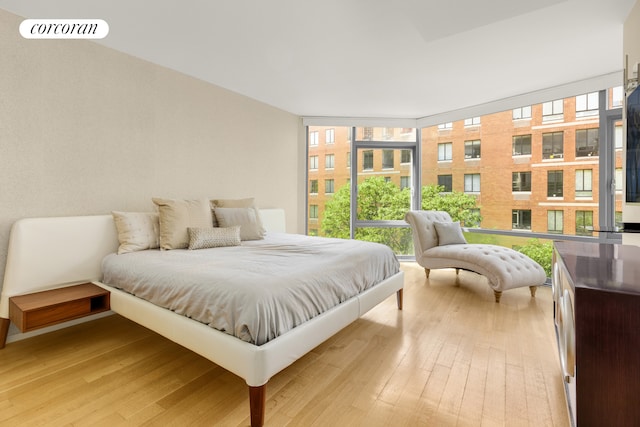 425 W 53rd St Unit 409, New York City, NY 10019 - bedroom featuring light wood finished floors and floor to ceiling windows
