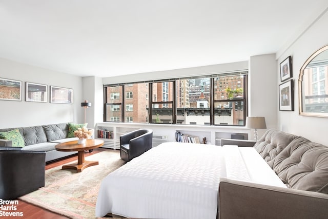 bedroom with hardwood / wood-style flooring