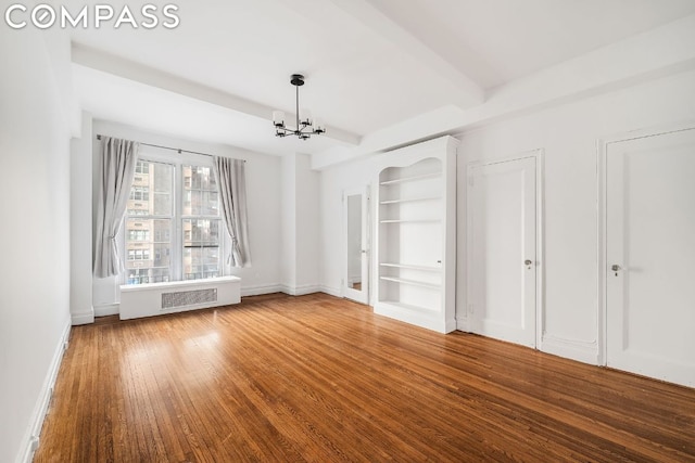 interior space featuring beamed ceiling, wood-type flooring, radiator, and a chandelier