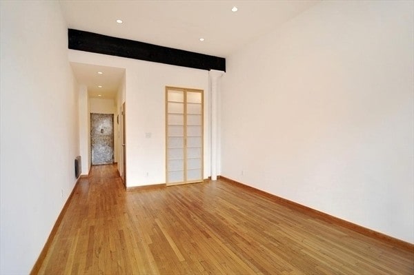 unfurnished room featuring wood-type flooring