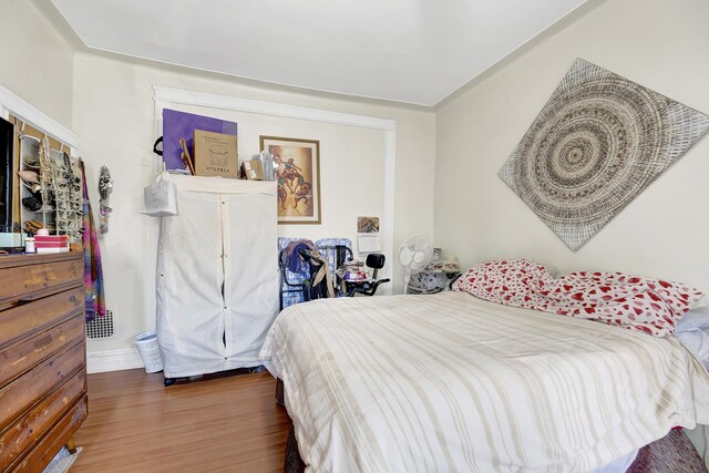 bedroom featuring wood finished floors