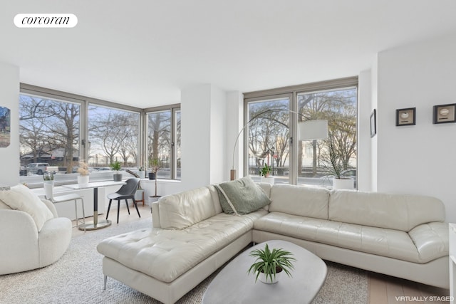 living area featuring visible vents and plenty of natural light