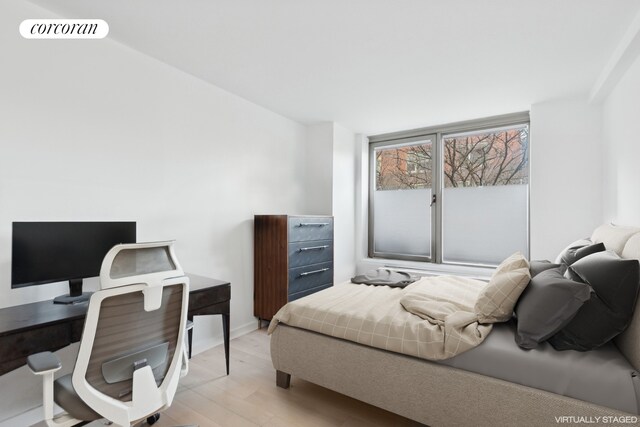 bedroom featuring light wood-type flooring