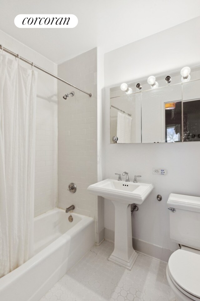 bathroom featuring tile patterned floors, toilet, and shower / bath combination with curtain