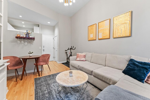 living room featuring bar and hardwood / wood-style floors