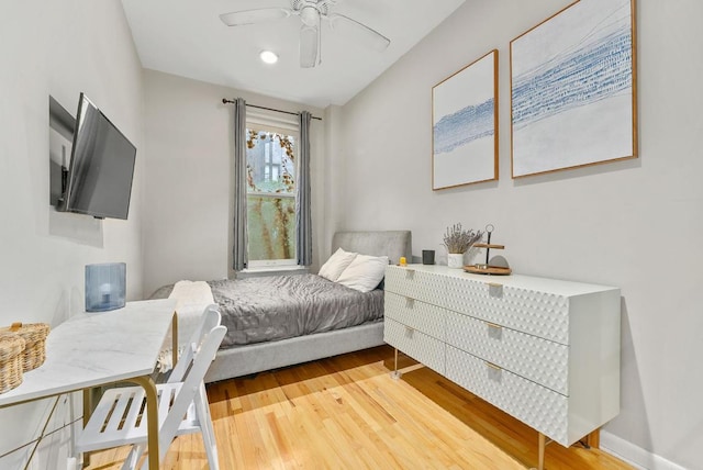 bedroom with wood-type flooring and ceiling fan