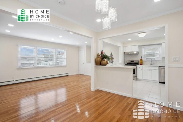 bathroom with toilet, baseboard heating, walk in shower, crown molding, and vanity