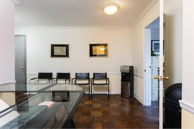 dining area with ornamental molding and baseboards