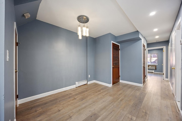7931 Seaview Ave Unit B1, New York City, NY 11236 - unfurnished room with a baseboard radiator, hardwood / wood-style flooring, baseboards, and recessed lighting