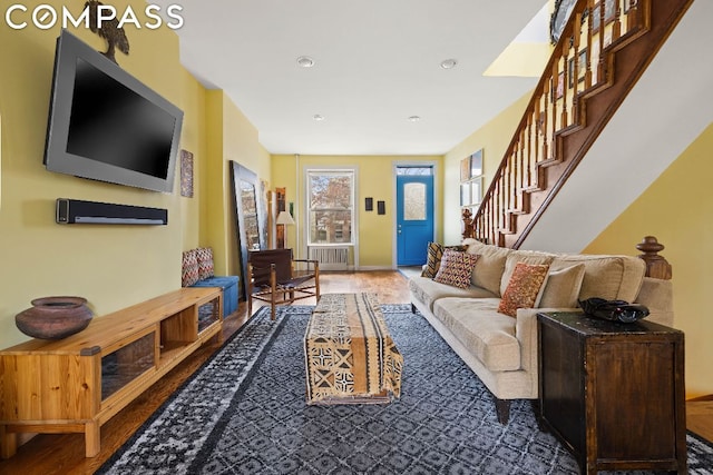 living room featuring radiator and wood-type flooring