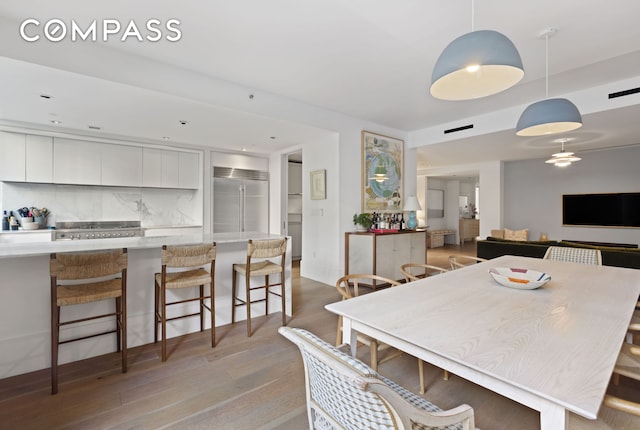 429 Kent Ave Unit Th2, New York City, NY 11249 - dining space featuring light wood finished floors