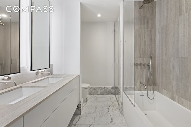 full bathroom featuring marble finish floor, double vanity, shower / bath combination, and a sink