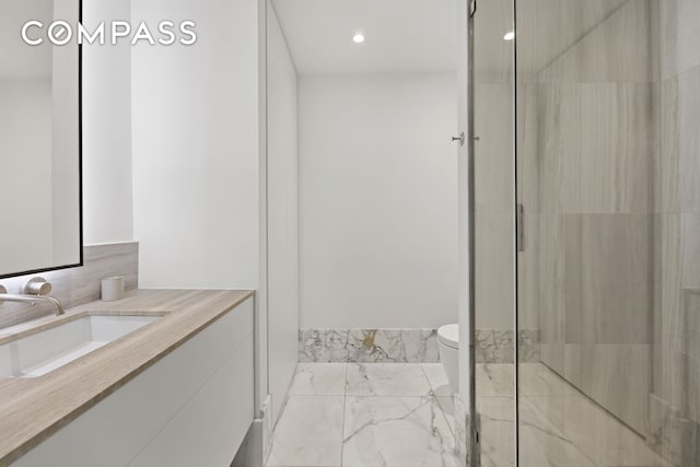 429 Kent Ave Unit Th2, New York City, NY 11249 - bathroom with marble finish flooring, vanity, toilet, a shower, and recessed lighting