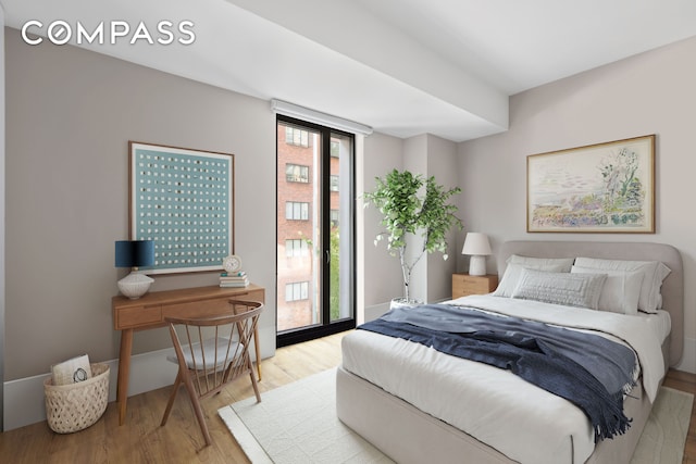 bedroom featuring wood finished floors