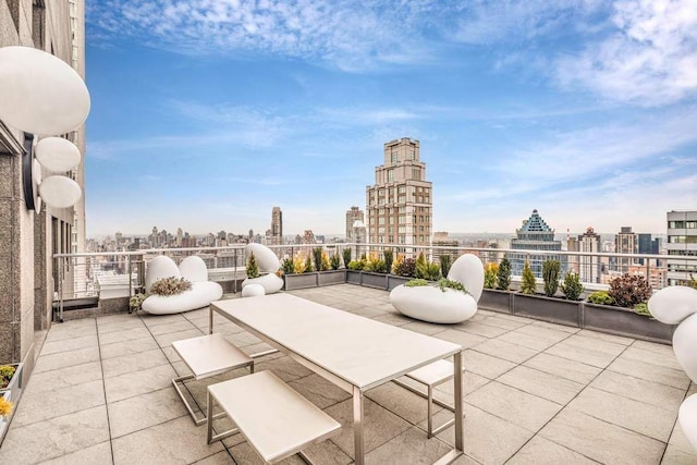 view of patio / terrace featuring a city view