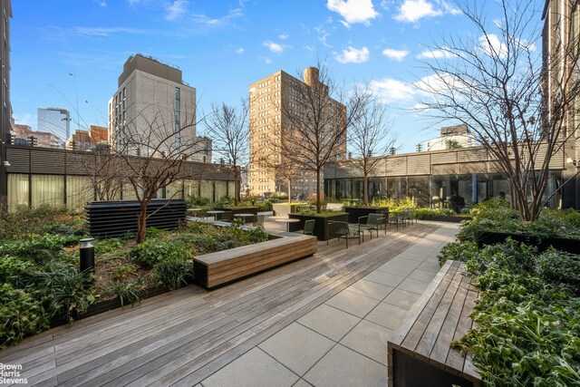 view of home's community featuring a view of city and fence