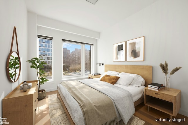 bedroom with wood-type flooring