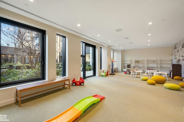 202 Broome St Unit 7L, New York City, NY 10002 - playroom featuring carpet floors and recessed lighting
