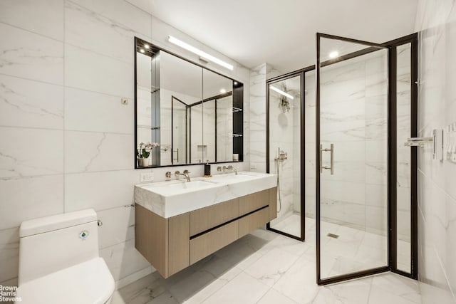 bathroom featuring vanity, toilet, tile walls, and walk in shower