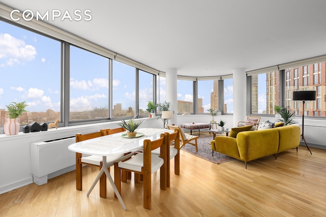 sunroom with a view of city and a healthy amount of sunlight