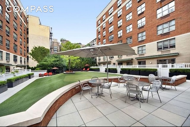 view of property's community with a patio area and fence