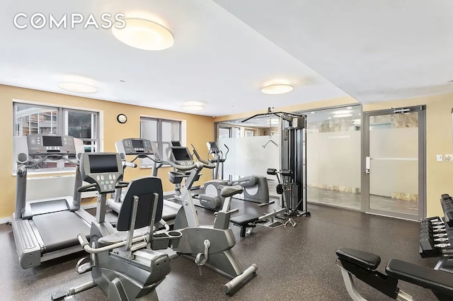 workout area featuring baseboards