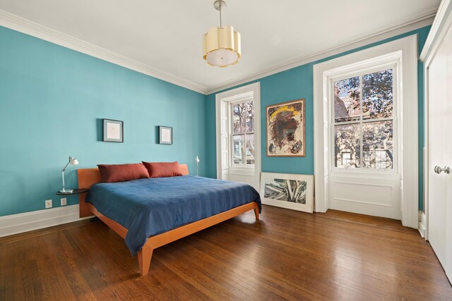 entryway featuring hardwood / wood-style floors and ornamental molding