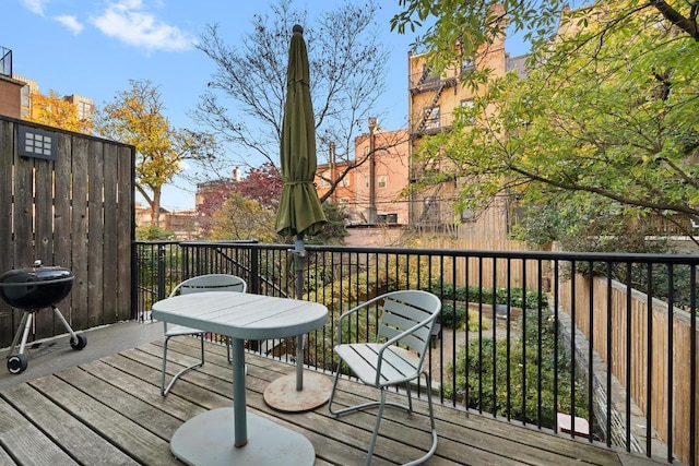 wooden deck with area for grilling