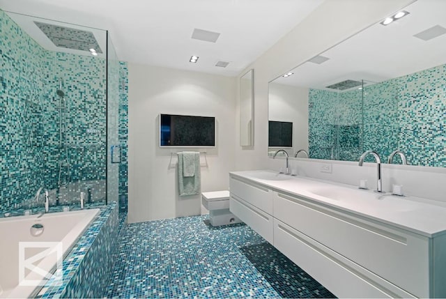 full bathroom with tile patterned floors, toilet, vanity, and separate shower and tub