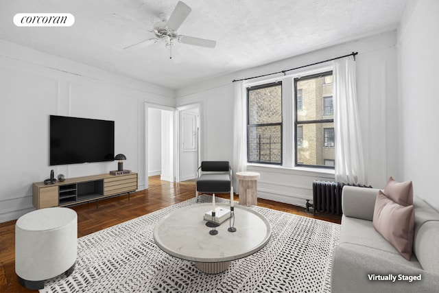 spare room with light wood-type flooring and a textured ceiling