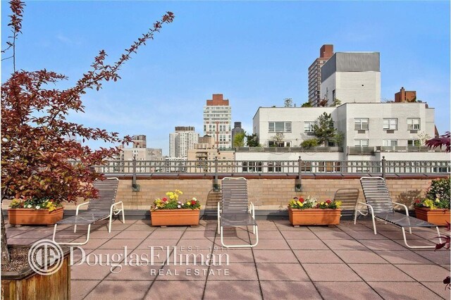 view of patio / terrace with a city view