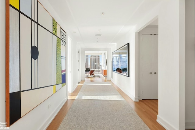 hallway featuring light hardwood / wood-style flooring