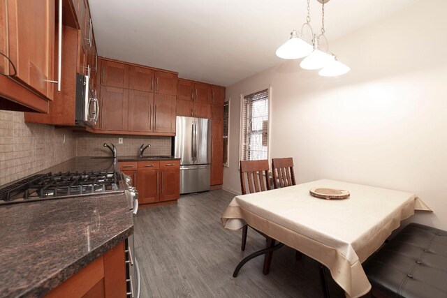 bedroom featuring light hardwood / wood-style flooring and stacked washing maching and dryer