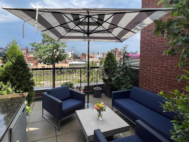 view of patio featuring a balcony and outdoor lounge area