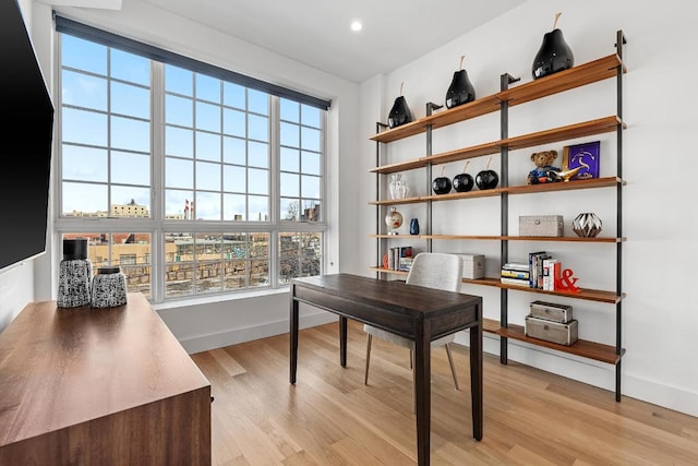 office space with light wood-type flooring