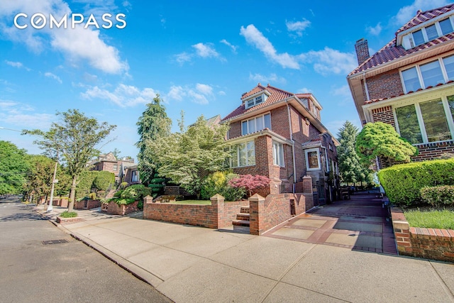 139 82nd St, New York City, NY 11209 - view of front of house with a chimney and brick siding