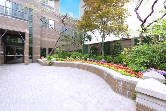 view of property's community featuring a patio