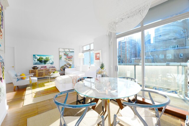 188 E 64th St Unit 1702, New York City, NY 10065 - dining area with wood finished floors