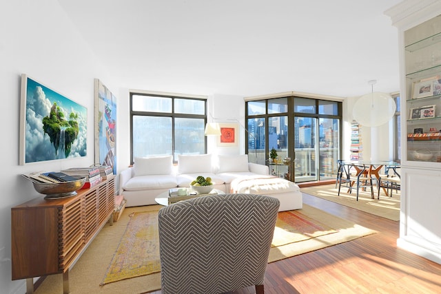 188 E 64th St Unit 1702, New York City, NY 10065 - living room with floor to ceiling windows and wood finished floors